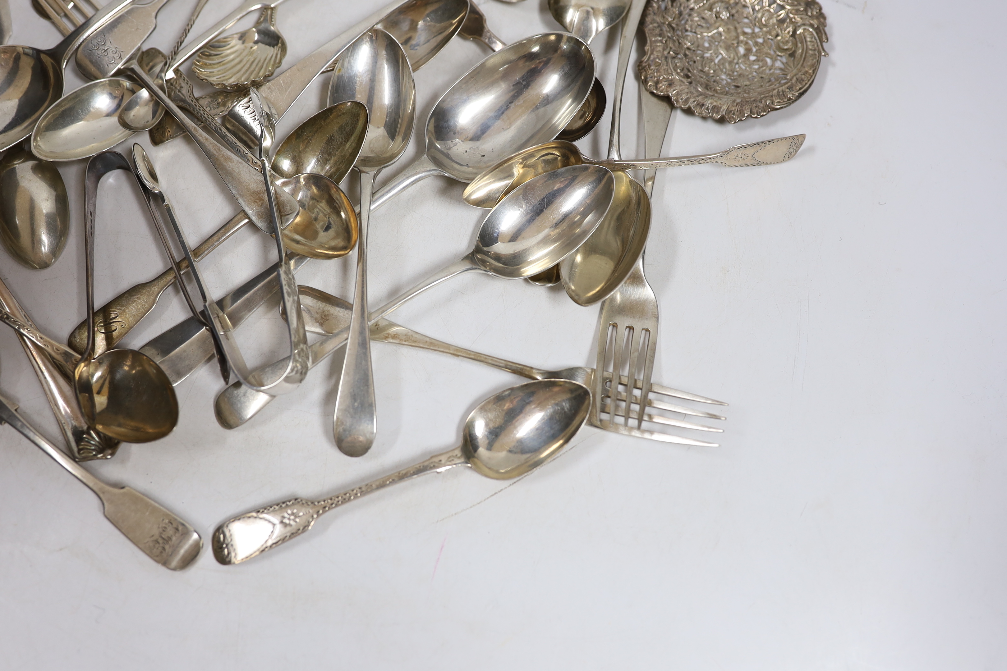 A quantity of assorted 19th century and later silver flatware, various patterns, dates and makers, including a set of silver bright cut engraved fiddle pattern teaspoons, 1843 and a Newcastle caddy spoon